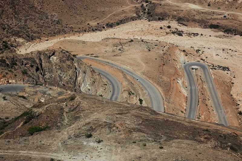 Serpentine road on the way to Yemen, landscape of southern Dhofar, Jabal al-Qamar, Oman, Asia