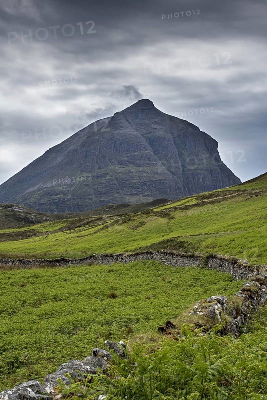 Old dry stone wall in front of mountain top Sàil Gharb, one Quinag's three separate Corbett summits in the Scottish Highlands, Sutherland, Scotland, United Kingdom, Europe