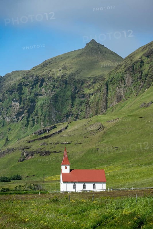 Vik Church, Víkurkirkja, between green mountains, Vík, South Iceland, Iceland, Europe