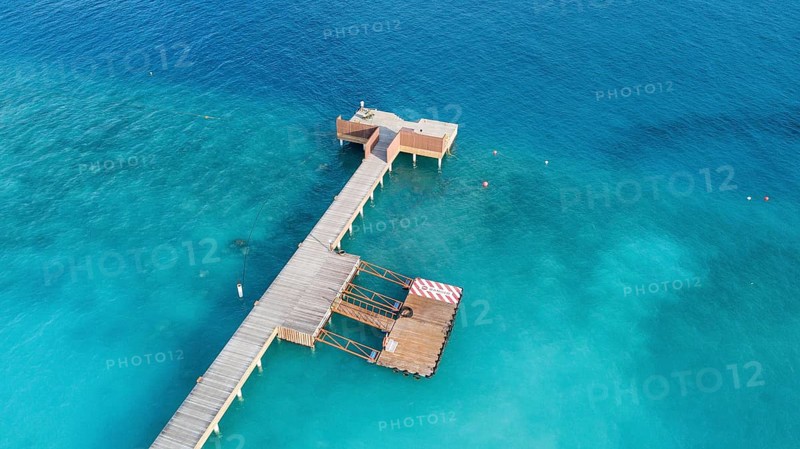 Aerial view bird's eye view of jetty of Maldives Island of Maldives, in foreground jetty for seaplane in background dock for boat Dhoni, Filaidhoo, Raa Atoll, Maldives, Asia