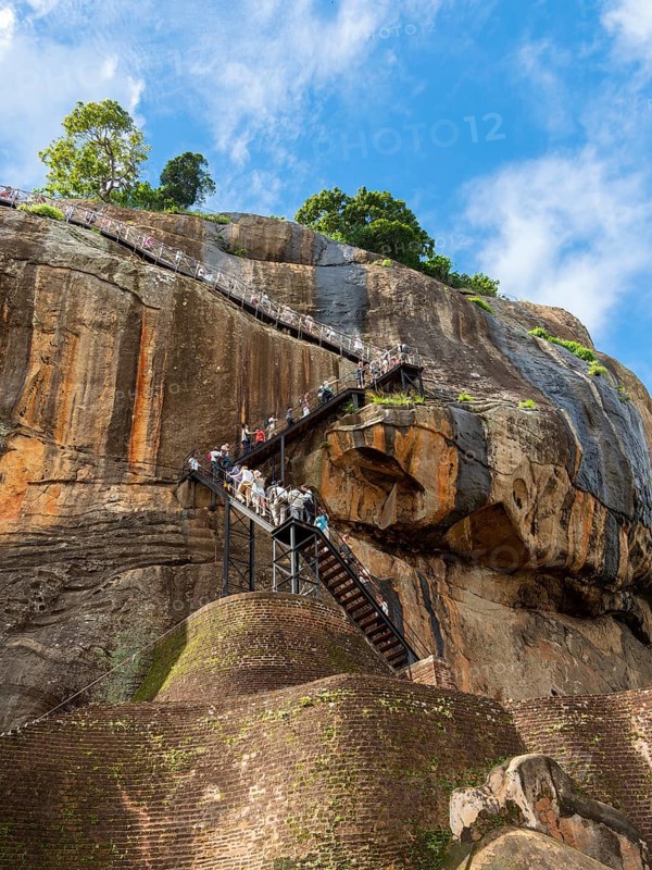Visitors climb the stairs at Sigiriya Rock, Sri Lanka, Asia