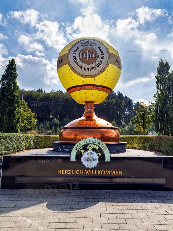 Hot air balloon on a brew kettle, brew kettle, welcome, logo, visitor centre of the Warsteiner Brewery, Warstein, Sauerland, North Rhine-Westphalia, Germany, Europe