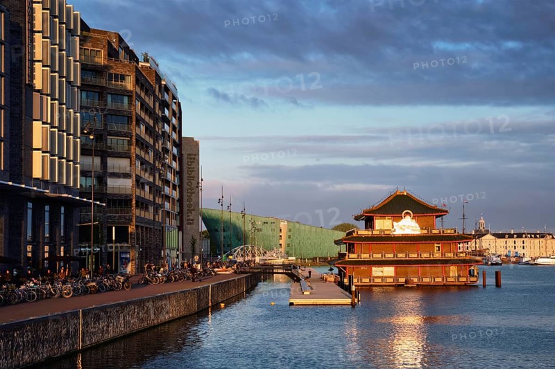AMSTERDAM, NETHERLANDS, MAY 9, 2017: Sea Palace chinese pagoda styled restaurant on sunset. It is the first floating restaurant in Europe