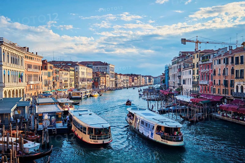 VENICE, ITALY, JUNE 27, 2018: Grand Canal with boats, vaporetto and gondolas on sunset from Rialto bridge, Venice, Italy, Europe