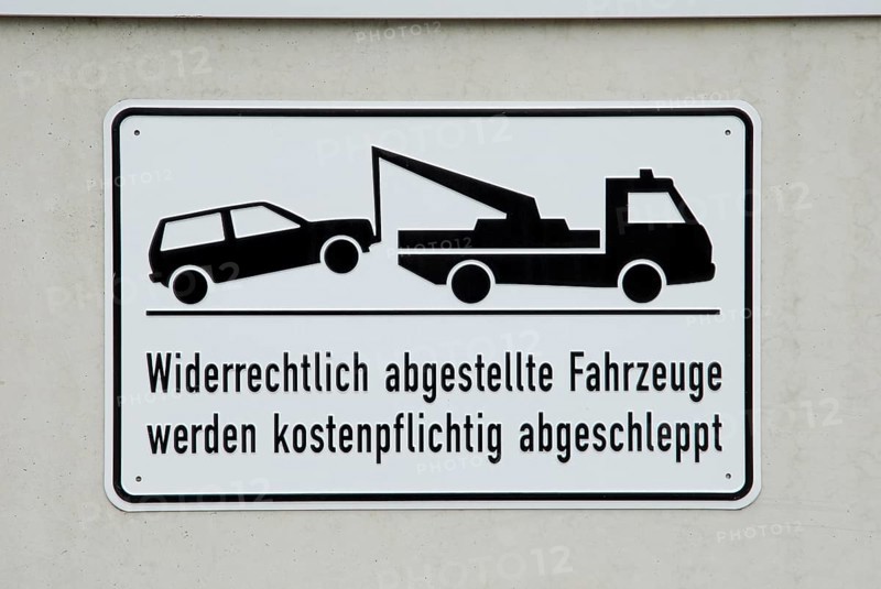 Traffic sign 'car will be towed away', illegally parked vehicles will be towed away at the owner's expense, sign