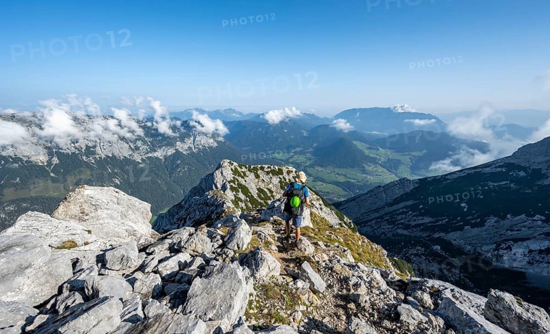 Mountaineer on a rocky path with mountain panorama, mountain tour to the summit of the Hochkalter, Hochkalter crossing, Berchtesgaden Alps, Bavaria, Germany, Europe