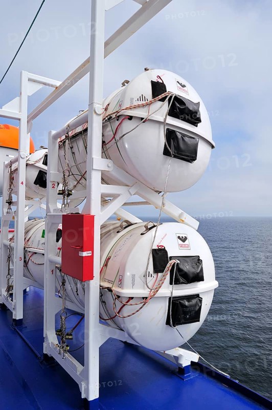 Inflatable life rafts in hard-shell canisters on board a ferry boat