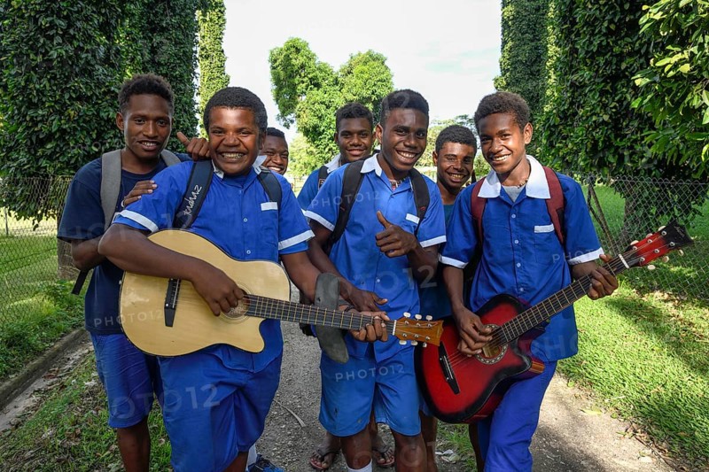 Pupils of the Catholic mission station of Vunapope in school uniforms and with guitars, Kokopo, formerly Herbertshöhe, from 1899 to 1910 administrative seat of German New Guinea, East New Britain, Papua New Guinea, Oceania