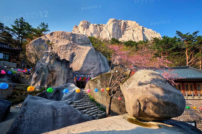 SEORAKSAN, SOUTH KOREA, APRIL 15, 2017: Kyejoam Seokgul Hermitage shrine and Ulsanbawi rock in Seoroksan National park, South Korea, Asia