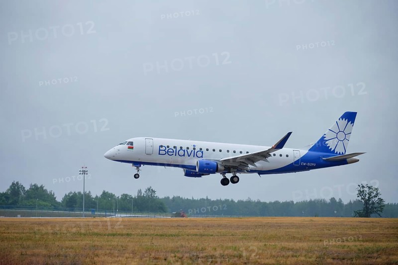 MINSK, BELARUS, JUNE 15, 2018: Belavia belarusian airlines flight Embraer ERJ-175 plane landing on runway in National Airport Minsk
