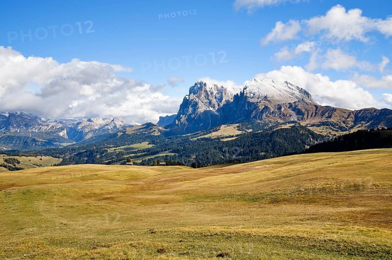 Snow-covered Plattkofel and Langkofel, Dolomites, Alpe di Siusi, snow, clouds and blue sky, Castelrotto, South Tyrol