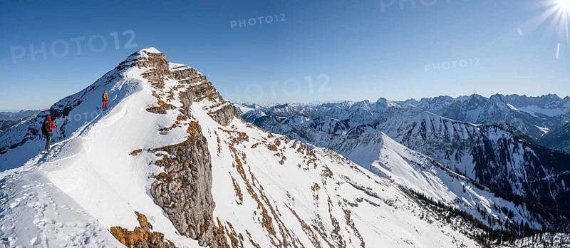 Two ski tourers on a snow-covered mountain ridge, summit of Schafreuter, view of snow-covered mountain panorama, Karwendel, Tyrol, Austria, Europe