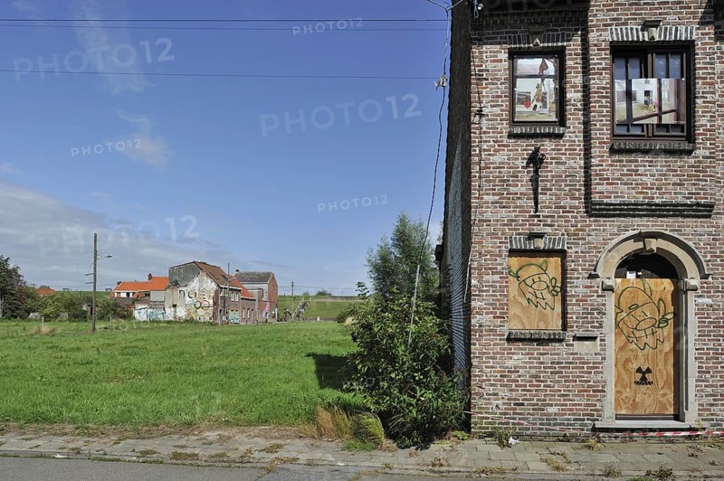 The desolate Flemish polder village Doel along the Antwerp port with abandoned houses covered in graffiti by squatters, Belgium, Europe