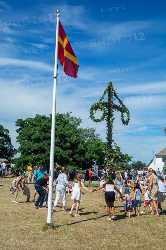 Traditional midsummer celebration with dancing around the maypole at Smygehuk, Smygehamn, Trelleborg Municipality, Skåne County, Sweden, Scandinavia, Europe