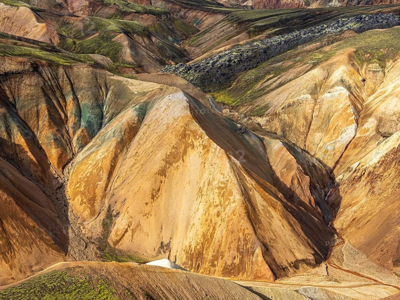 Colorful rhyolite mountains, lava field below mt. Brennisteinsalda, Landmannalaugar, Fjallabak Nature Reserve, Iceland, Europe