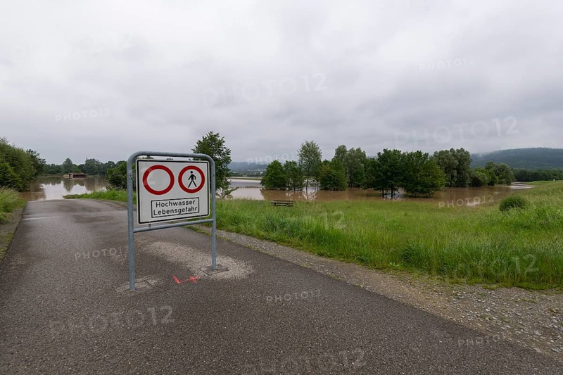 Symbolic image extreme weather, global warming, climate change, information board, flood retention basin, flood protection, danger to life, flooded meadows, deciduous trees, Rems valley, Winterbach, Rems river, Baden-Württemberg, Germany, Europe