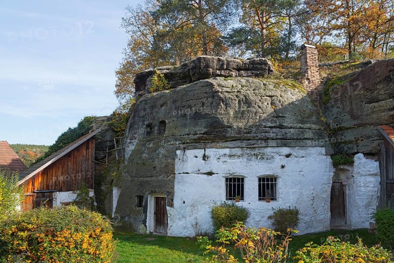 A rustic house integrated into a rock face, surrounded by autumn vegetation, rock dwelling, museum, Lhotka u Melníka, Melnik, Central Bohemia, Czech Republic, Europe