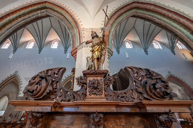 Figure of Jesus with the Lamb of God on the chancel entrance in the church of St Martin, Memmingen, Bavaria, Germany, Europe