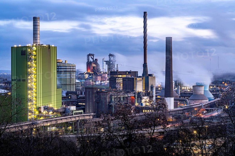 Panorama of the Thyssenkrupp Steel steelworks in Duisburg-Bruckhausen, in front the gas-fired power plant Hamborn, green facade of the boiler house Block5, in the centre the blast furnaces 8 and 9, North Rhine-Westphalia, Germany, Europe