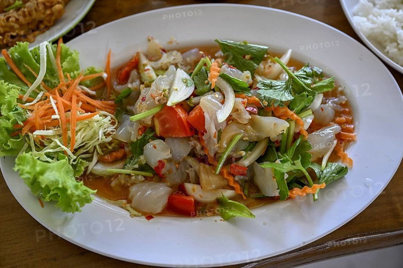 Spicy jellyfish salad with celery, onions, chilli, lime and fresh coriander leaves in a street restaurant, Min Buri, near Bangkok, Thailand, Asia