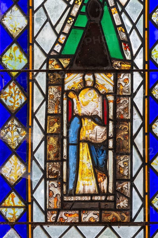 Stained glass of east window medieval fragments, Church of Saint Nicholas, Rushbrooke, Suffolk, England, UK, depiction of a bishop