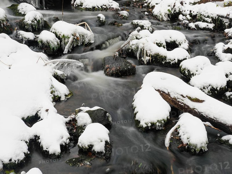 Hill Stream, the Schwartzbach, in snow and ice in November. The Rhön UNESCO Biosphere nature reserve, county Bavaria, Germany, Europe