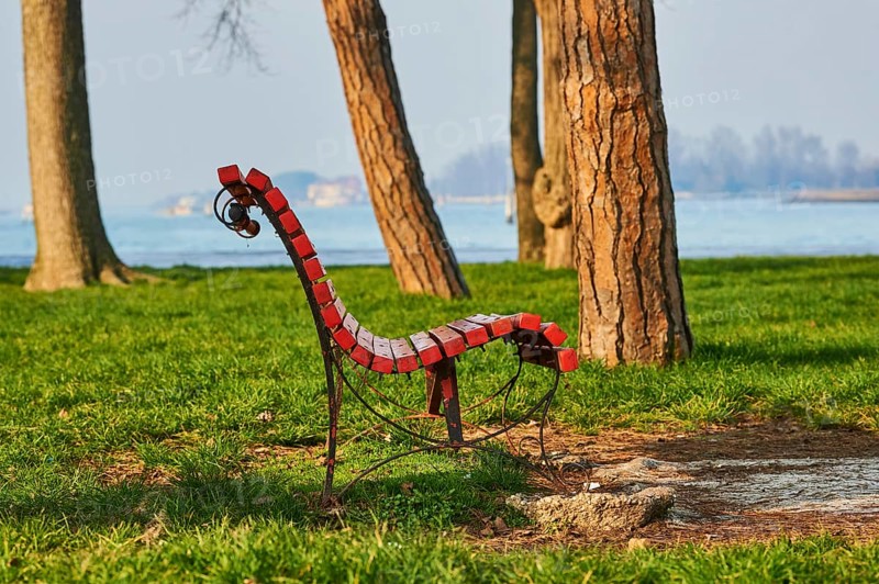 Park bench in a park at the harbor of Murano, Venice, Italy, Europe