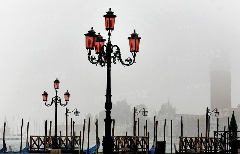 View of San Giorgio Maggiore from the cloudy Piazza San Marco with its old lanterns, 19.10.2008, Venice, Italy, Europe