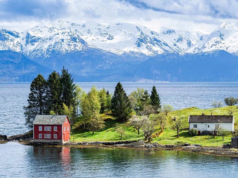 Typical red house on an island in the Hardangerfjord, near Strandebarm, Hordaland, Norway, Europe