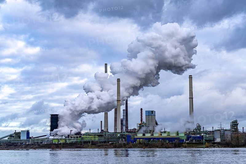 Industrial backdrop of the ThyssenKrupp Steel steelworks in Duisburg-Bruckhausen, on the Rhine, blast furnaces, Schwelgern coking plant, extinguishing cloud, Duisburg, North Rhine-Westphalia, Germany, Europe