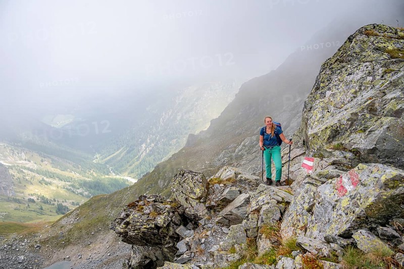 Hiker in the fog, Alpine dangers, Carnic Main Ridge, Carnic High Trail, Carnic Alps, Carinthia, Austria, Europe