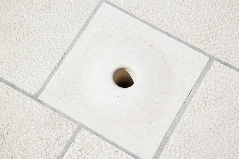 Close-up of hollowed out Sea Organ sound emitting hole in marble step created by architect Nikola Bašic, Zadar, Croatia, Europe