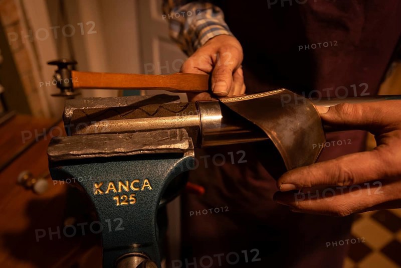 Metal instrument maker dovetails a rim blank for a trombone, Magdeburg, Saxony-Anhalt, Germany, Europe