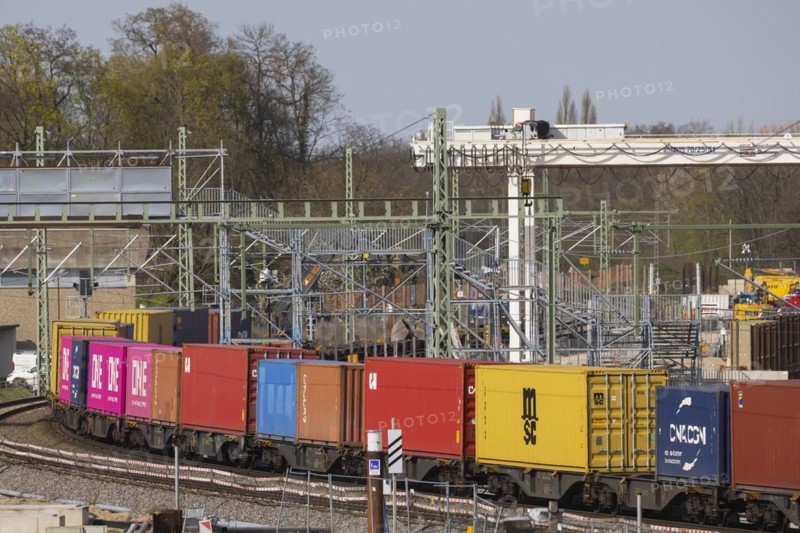 Rastatt Tunnel construction site on the Rhine Valley line with goods train, Deutsche Bahn AG infrastructure project. Construction work began in 2013 and was due to be completed in 2022. Due to an accident involving a tunnel boring machine, the project has been delayed and is now scheduled for completion in 2026, Rastatt, Baden-Württemberg, Germany, Europe
