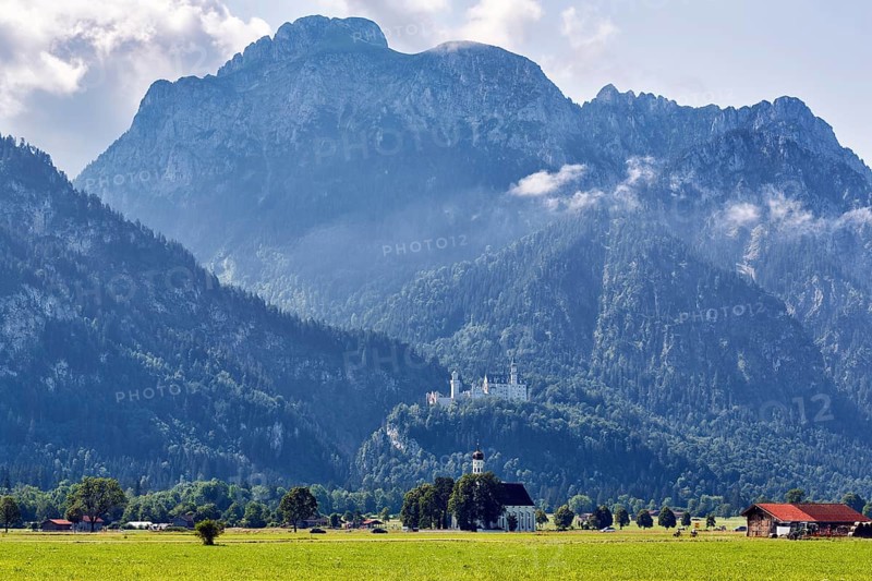 Neuschwanstein Castle in the morning mist, pilgrimage church of St Coloman, summer, Tegelberg, Schwangau, Ostallgäu, Allgäu, Swabia, Upper Bavaria, Bavaria, Germany, Europe