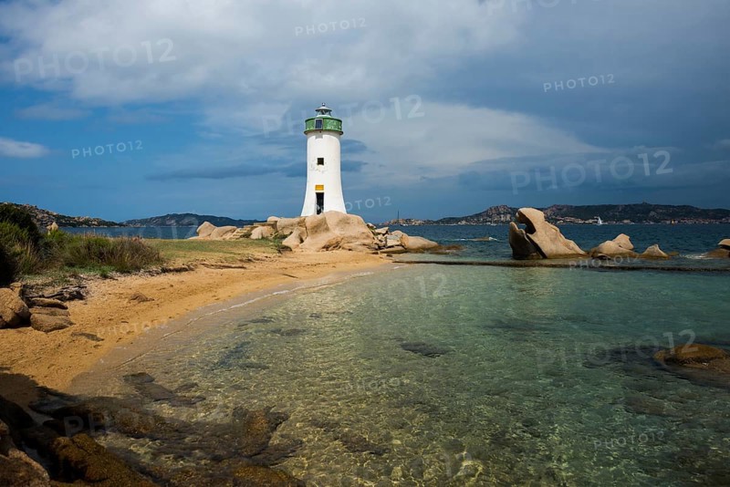 Lighthouse with beach and bizarre granite rocks, Spiaggia Porto Faro, Faro di Punta Palau, Palau, Costa Smeralda, Sardinia, Italy, Oceania