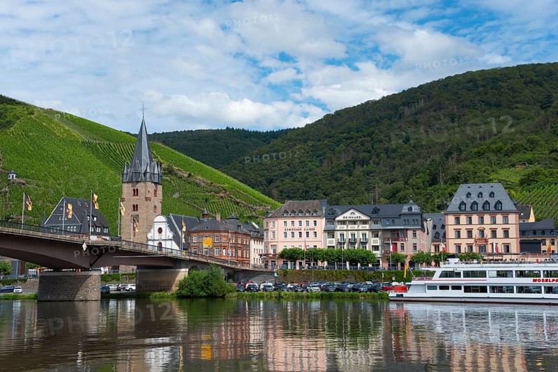 Town view with church tower and bridge over a river, surrounded by vineyards and hills, Bernkastel district, Bernkastel-Kues, Moselle, Rhineland-Palatinate, Germany, Europe