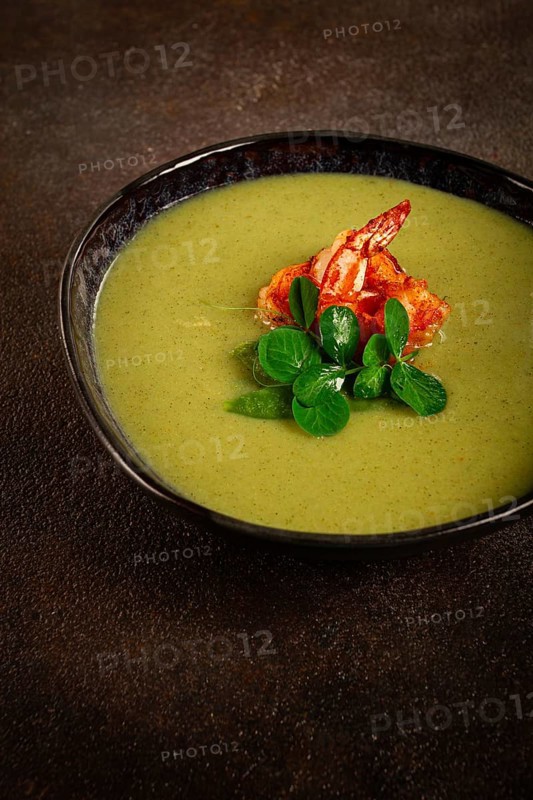 Pea cream soup, with shrimp, green soup, homemade, top view, no people