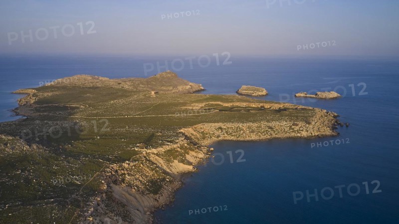 Drone shot, near Acropolis of Lindos, late afternoon light, drone shot of a remote island with rocky coastline at sunset, Archaeological Site, Lindos, Rhodes, Dodecanese, Greek Islands, Greece, Europe