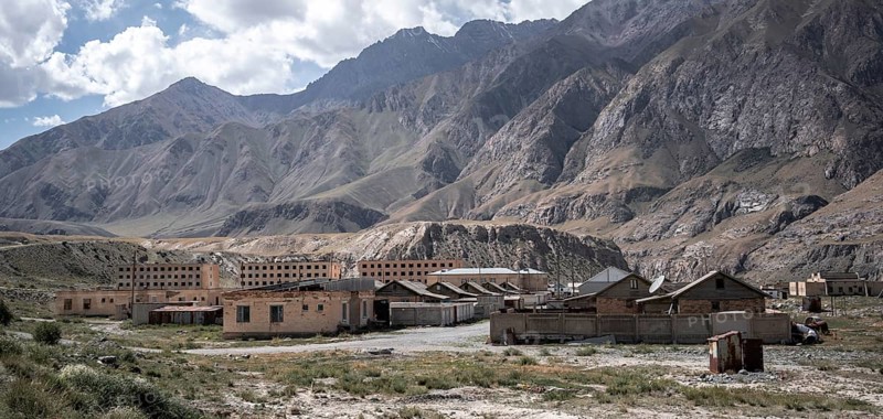 Abandoned ruined buildings in a mountain landscape, ghost town, Engilchek, Tian Shan, Kyrgyzstan, Asia