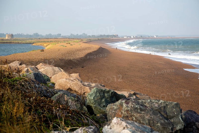 North Sea coastline view of rock armour and beach bar north to Shingle Street, East Lane, Bawdsey, Suffolk, England, UK