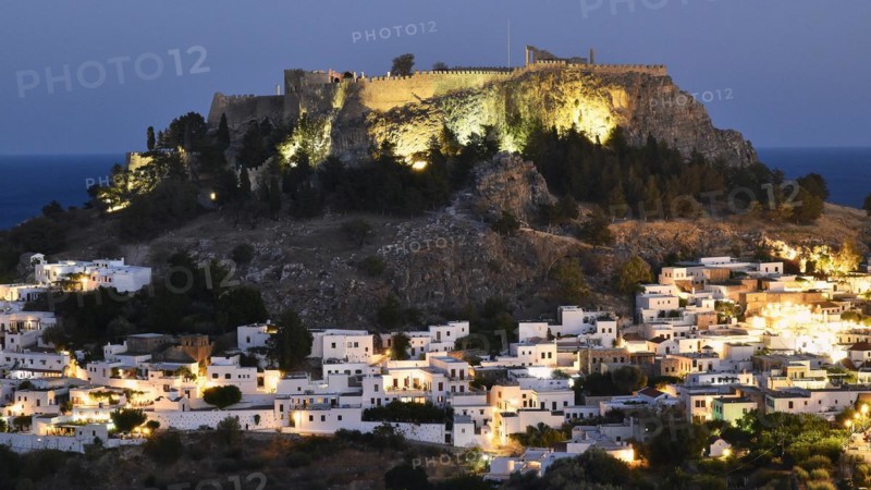 Night view of an illuminated fortress above a quiet village with winding streets, Acropolis of Lindos, Lindos, Rhodes, Dodecanese, Greek Islands, Greece, Europe