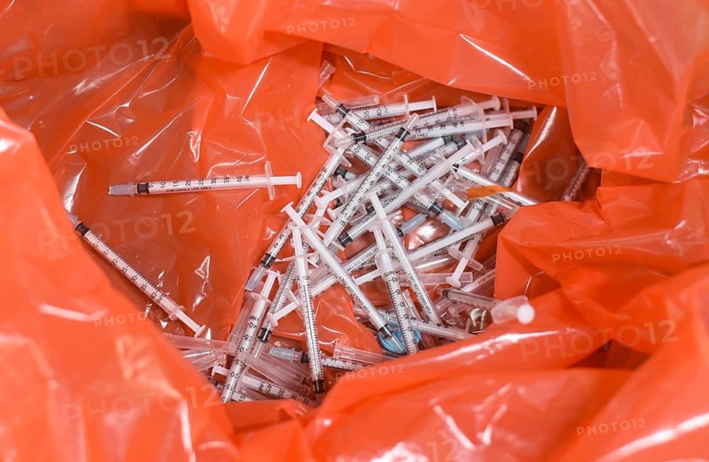 Disposed syringes are seen after a health worker inoculates students with a dose of a Covid-19 coronavirus vaccine during a vaccination drive for people in the 15-18 age group at a school in Guwahati, Assam, India on January 3, 2022. India has detected more than 1, 700 cases of Omicron variant of novel coronavirus infection