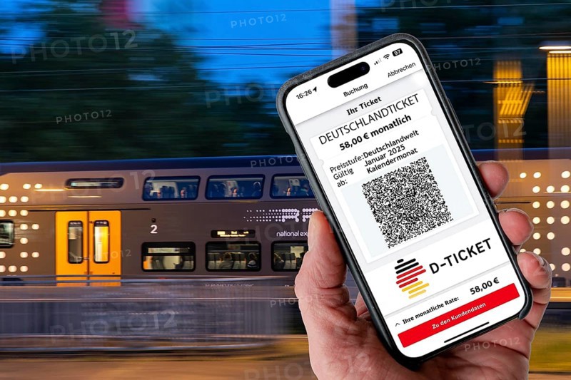 Symbolic image of Deutschlandticket, new from 2025 for 58 euros per month, ticket on mobile phone app, travel on regional transport throughout Germany, for one fare with bus and train
