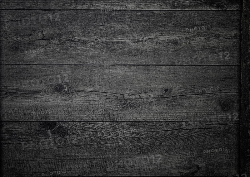The rich, dark wood surface features intricate grain patterns and textures, creating a warm and inviting atmosphere suitable for various design concepts.