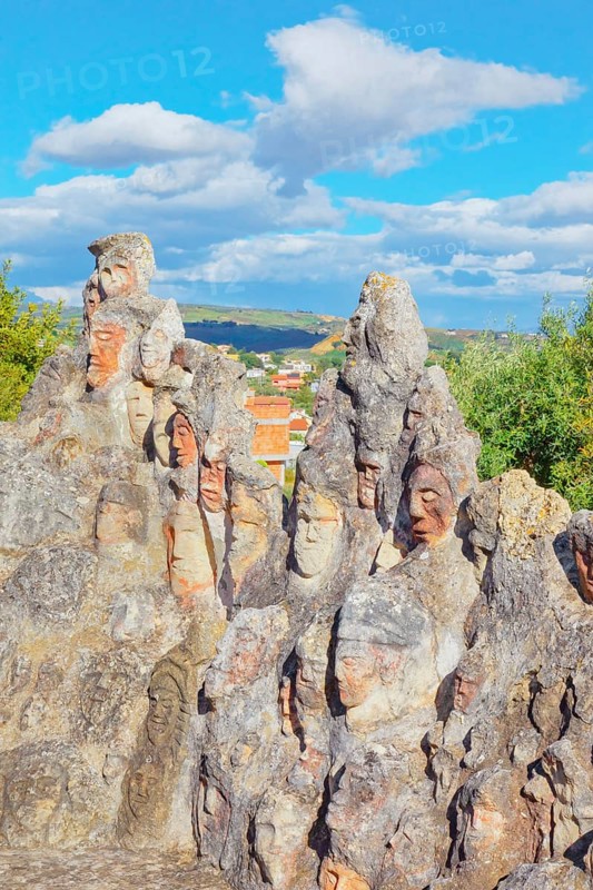 Heads carved into rocks at Enchanted Castle, Sciacca, Agrigento district, Sicily, Italy, Europe