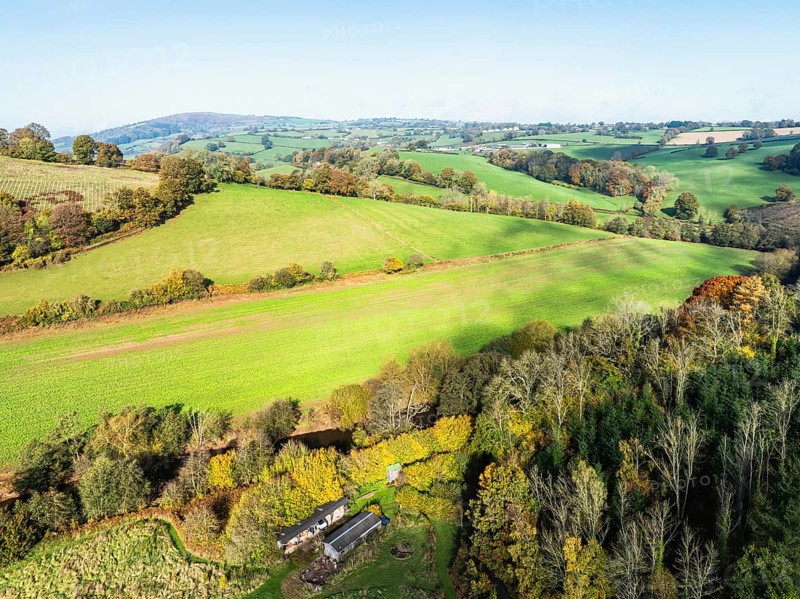 Fields and Farms over Skenfrith Castle from a drone, Monmouthshire, Wales, England, United Kingdom, Europe