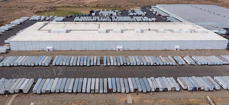 Los Lunas, New Mexico, A Walmart distribution center. Trucks wait their turn on the road outside the warehouse
