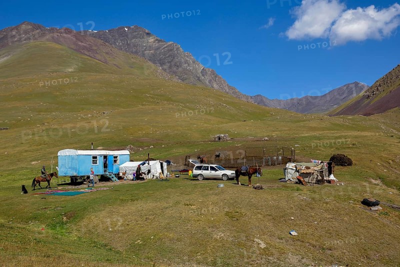 Shepherds with their caravan on their summer pasture, Dshajloo, West Karakol Valley, Tien Shan Mountains, Naryn region, Kyrgyzstan, Asia