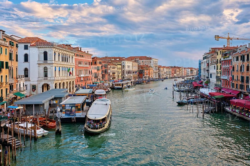 VENICE, ITALY, JUNE 27, 2018: Grand Canal with boats, vaporetto and gondolas on sunset from Rialto bridge, Venice, Italy, Europe